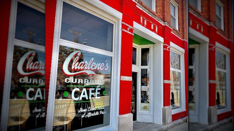 The front windows of the bright red facade at Charlene's Curbside Cafe