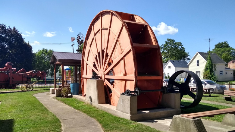 Exterior of the Wallaceburg Museum with a path and and old water wheel, Wallaceburg, Ontario
