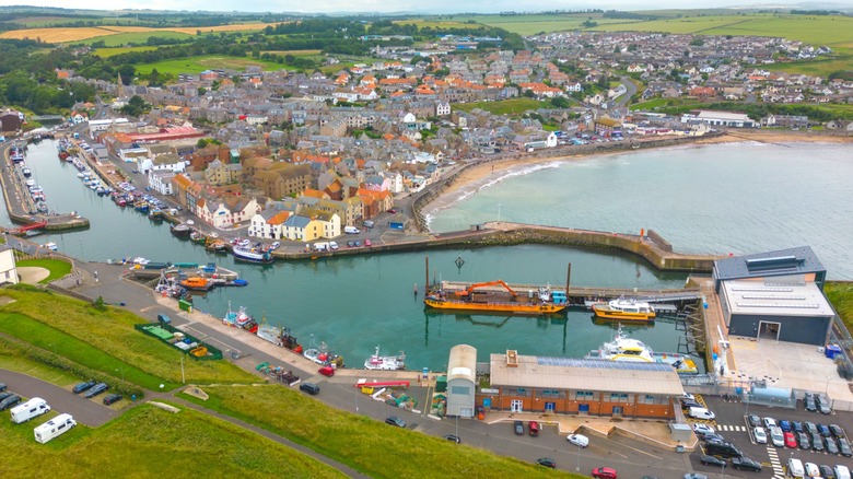 Aerial view of the harbor and small granite coastal houses in Eyemouth