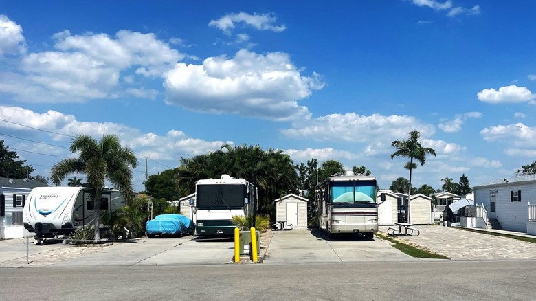 RVs parked in a row at Lake San Marino RV Resort in Naples, Florida