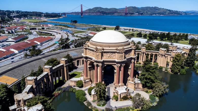 Palace of Fine Arts in Marina District of San Francisco with Golden Gate Bridge in background