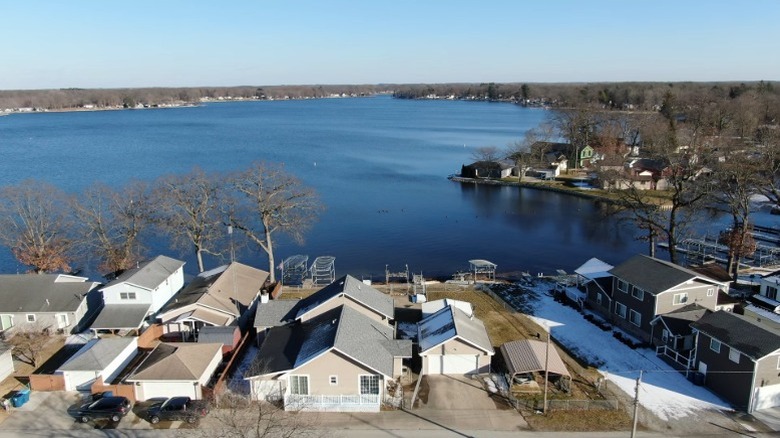 Homes on the shore of Koontz Lake on a sunny day.