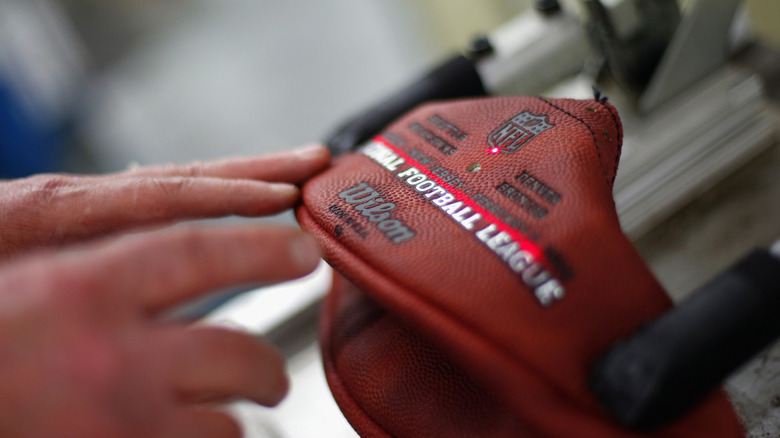 NFL football being made by hand at Wilson Sporting Goods