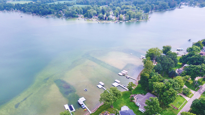 An aerial photo in Coldwater, Michigan with lakeside houses and docks into the water