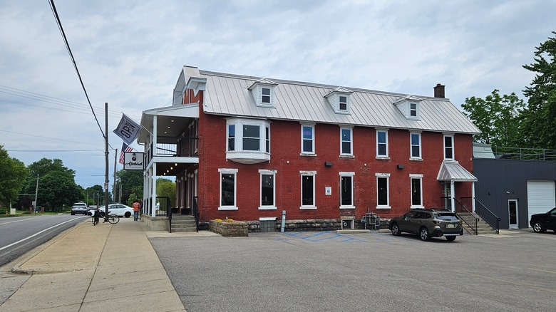 A historic early 1900s hotel building that is now a restaurant in Byron Center