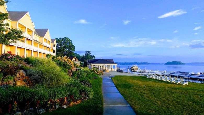 Shelbyville's Bay Pointe Inn and Gun Lake, with chairs, docks, and the shoreline in the distance