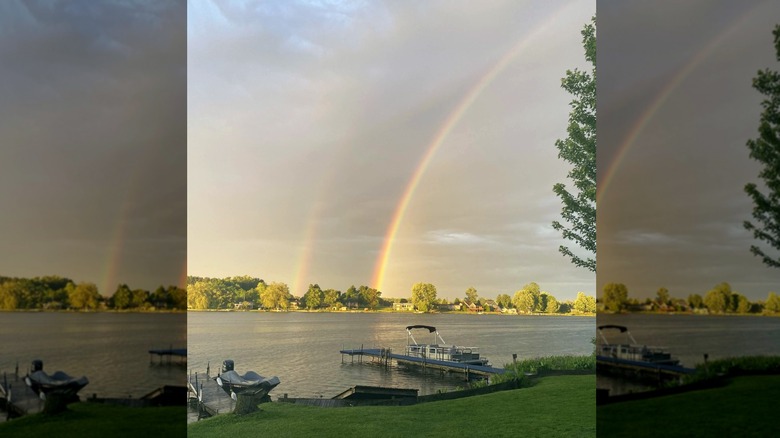 View of a rainbow over the lake at East Lake Camping in Hopkins, Michigan