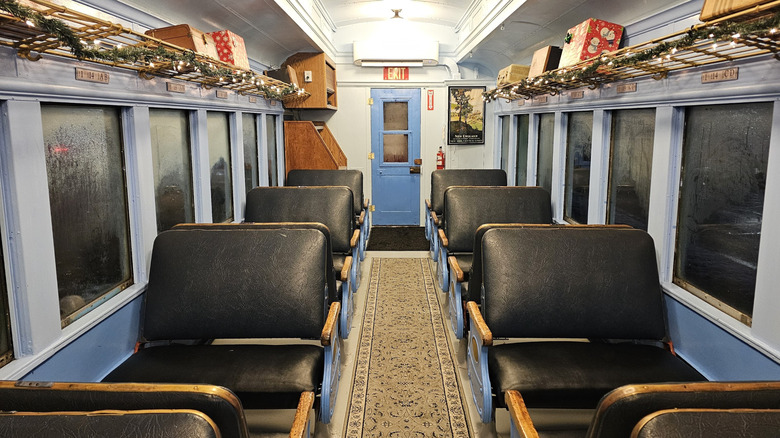Vintage seats and luggage inside a carriage on the Coopersville & Marne Railway train