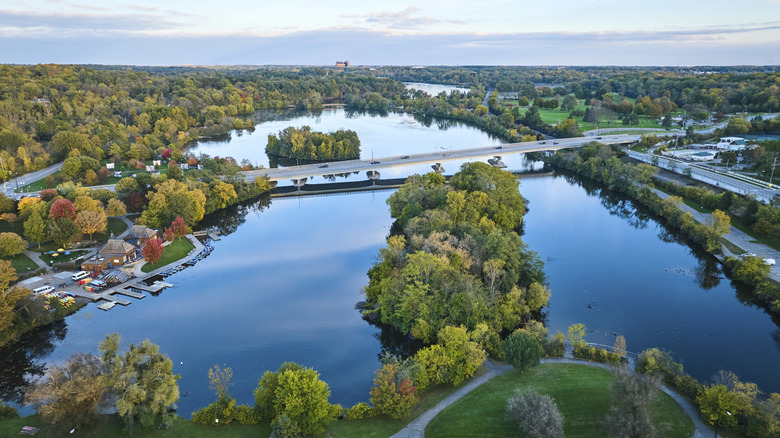 Aerial view of Grand River Michigan surrounded by green parkland and trees