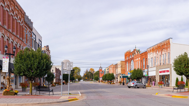 Historic downtown Ithaca with two-story red-brick buildings lining both sides of the road
