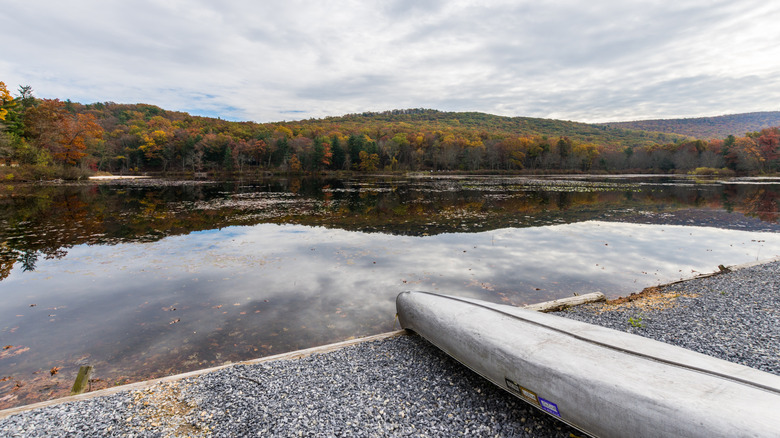 The edge of Laurel Lake with an overturned canoe in Pine Grove Furnace State Park.