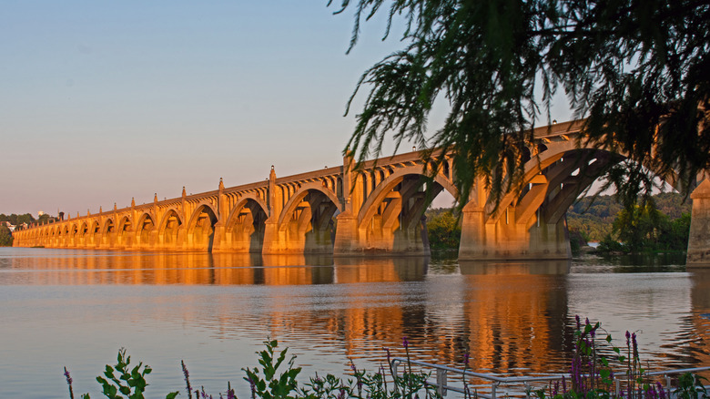 Looking south at the Veteran's Columbia-Wrightsville Bridge spanning the Susquehanna at sunset from the shore in Wrightsville
