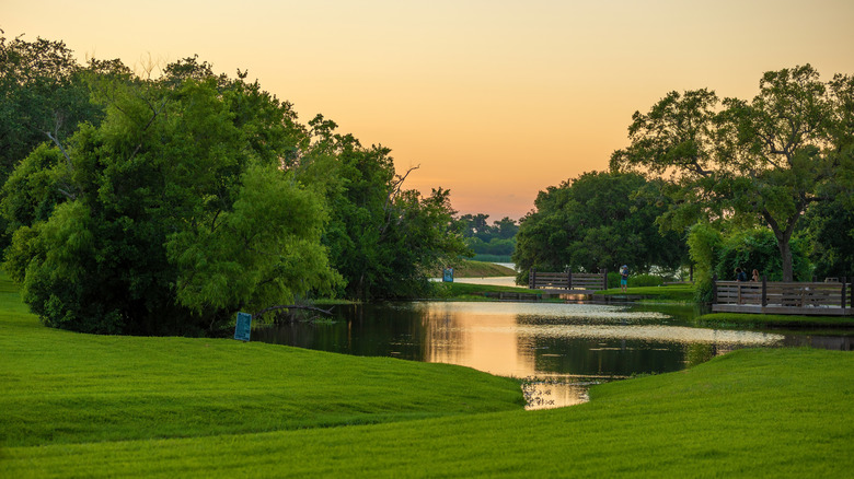People enjoying evening at bayou, League City, Texas