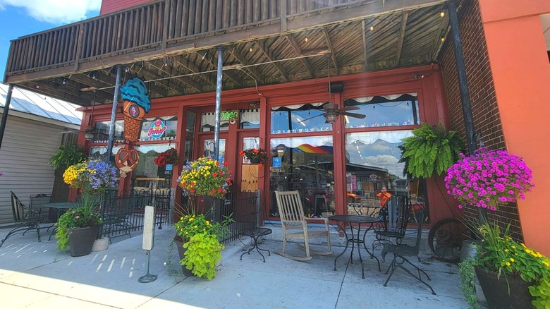 A sidewalk patio outside What's the Scoop ice cream shop in Brookville, Ohio