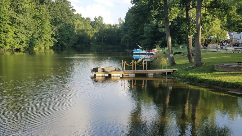 A boat dock on the lake at Batesville KOA Journey Campground