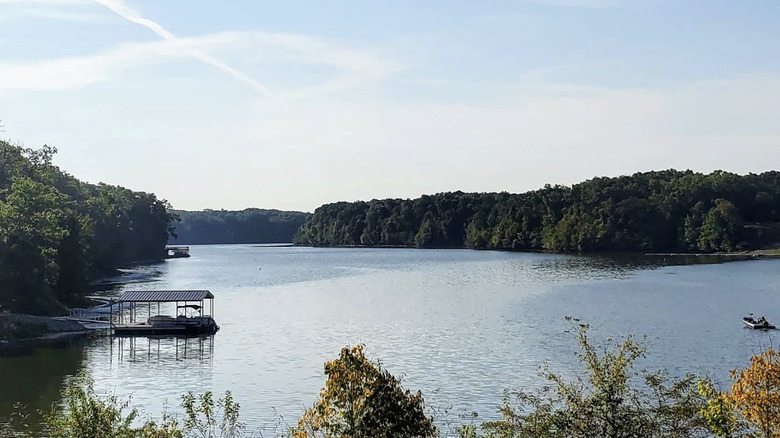 A view of Mill Creek Lake and a dock and fishing boat in the distance
