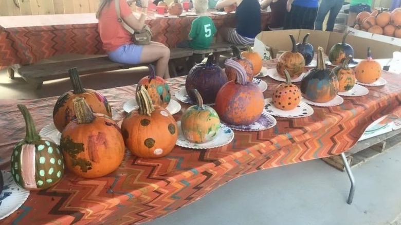 Painted pumpkins on table