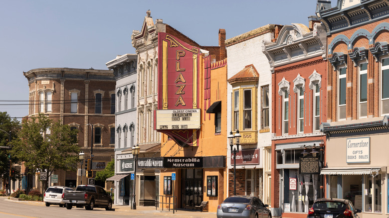 Historic storefronts line a sunny street in downtown Ottawa, Kansas