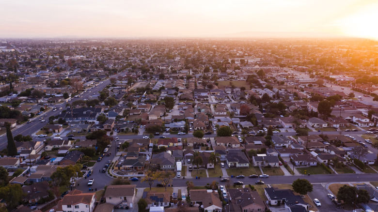 A residential section of the city of Downey, California, at sunset from a drone
