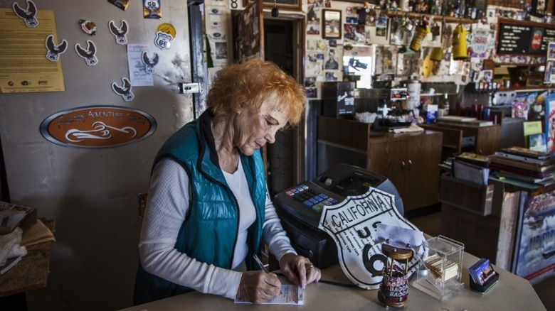 Bagdad Cafe owner Andrea Pruett surrounded by Route 66 memorabilia.