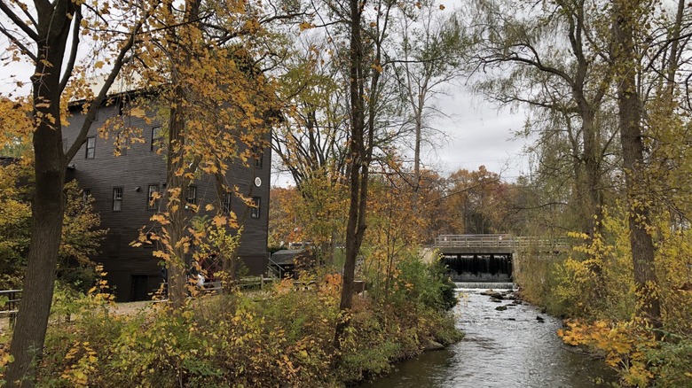 Parshallville Cider Mill by the creek in autumn