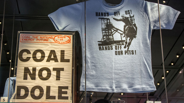 Exhibits of a poster and t-shirt from the coal miners strikes, on show in a Barnsley museum