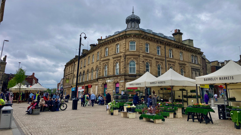 Barnsley's outdoor market stalls with indoor mall in the background