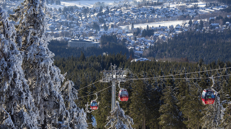 Snowy landscape from Wurmberg mountain showing red gondolas and the town of Braunlage below
