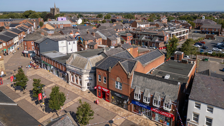 Aerial view of High Street in Ormskirk, U.K., with historic buildings and a cathedral in view