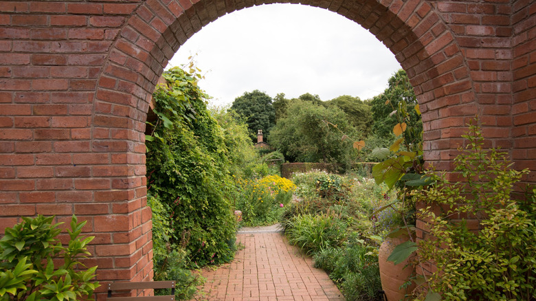 Brick arch framing the gardens at the Norton Priory in Runcorn, England