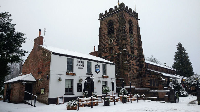 The Parr Arms pub covered in snow in Grappenhall, U.K.