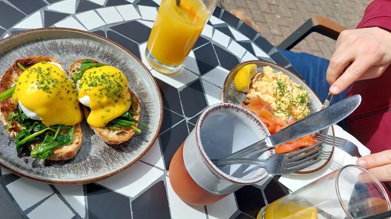 Eggs benedict and scrambled eggs at Peppermill Bar and Kitchen, Buntingford, England