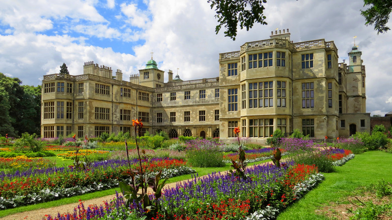 View of the facade and flowers at Audley End House and Gardens