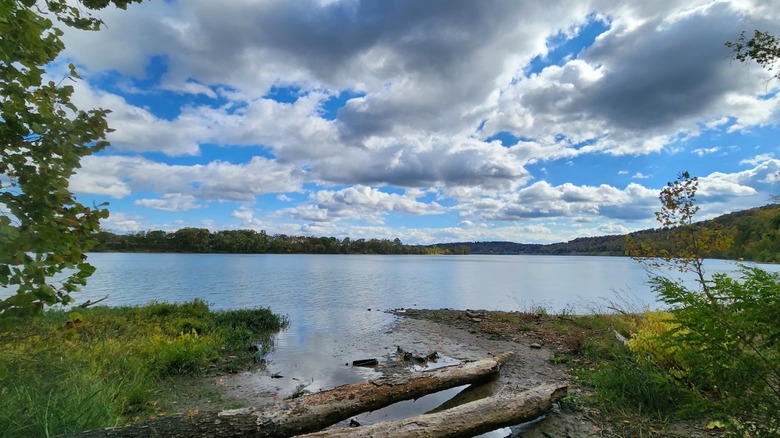 The Ohio River beneath a cloudy blue sky as viewed from Buzzard Roost Recreation Area.