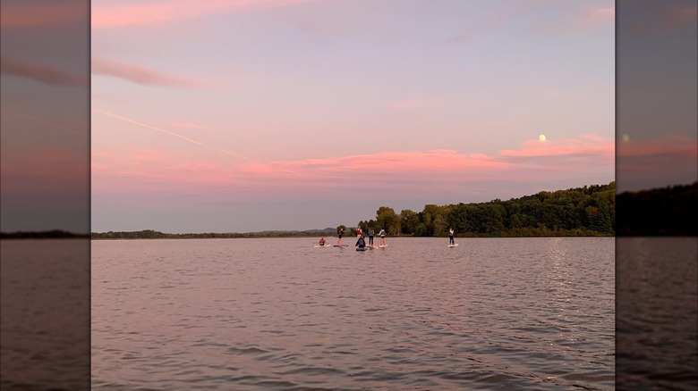 Paddleboarding on Neshonoc Lake at sunset