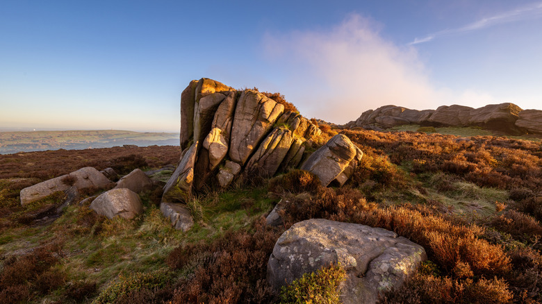 Golden hour sunrise at The Roaches near Leek with dramatic rock outcrops and distant countryside.
