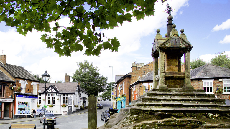The Lymm Cross monument in the heart of Lymm, England