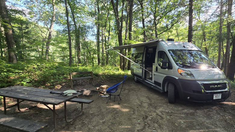 A campervan setup and picnic table at the Mill Bluff State Park Campground