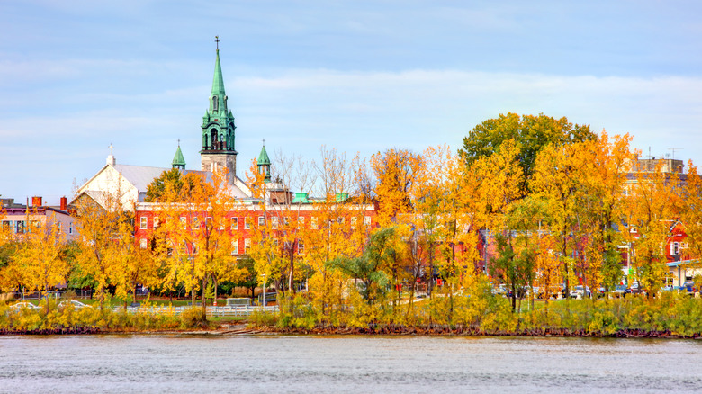 Blazing yellow trees partly cover the old brick buildings and steeples of the Saint-Jean-sur-Richelieu skyline