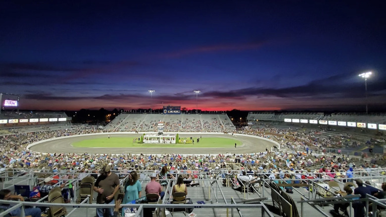 Panoramic view of outdoor arena during Tennessee Walking Horse National Celebration at night.