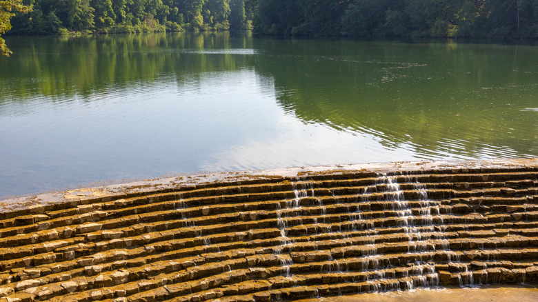 Water cascading over rocks at the spillway at Lake Woodhaven in Montgomery Bell State Park