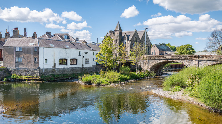 Old stone buildings and bridge overlooking the River Teviot