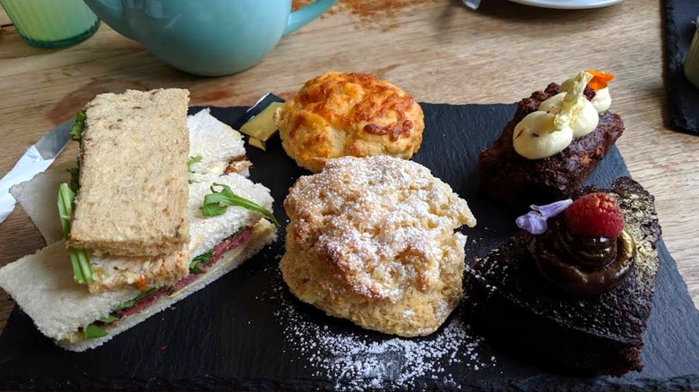Sandwiches and baked goods on a plate at Hive Coffee Company, a cafe in Jarrow, England
