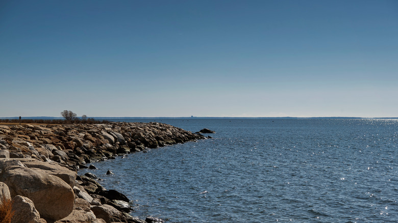View of a rocky jetty jutting into the Long Island Sound at Sherwood Island State Park