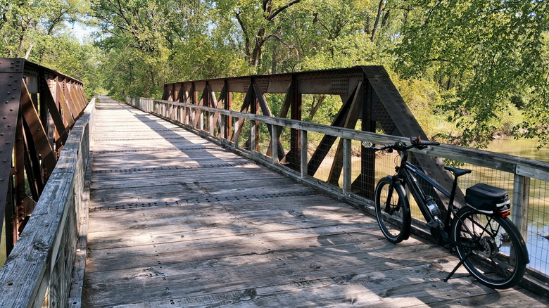 A bike resting along the Middle River Bridge on the Summerset Trail in Banner Lakes at Summerset State Park in Summerset, Iowa