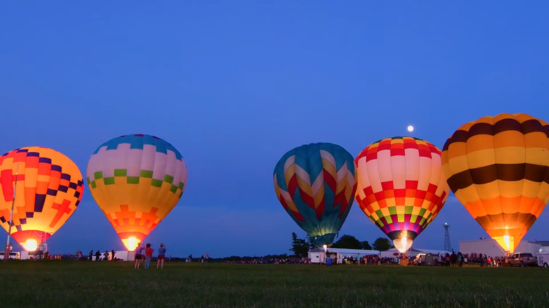 Hot air balloons lit up in the evening in Falls City, Nebraska