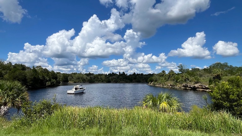 A small boat anchored on the barge canal portion of the Cross Florida Greenway near Yankeetown