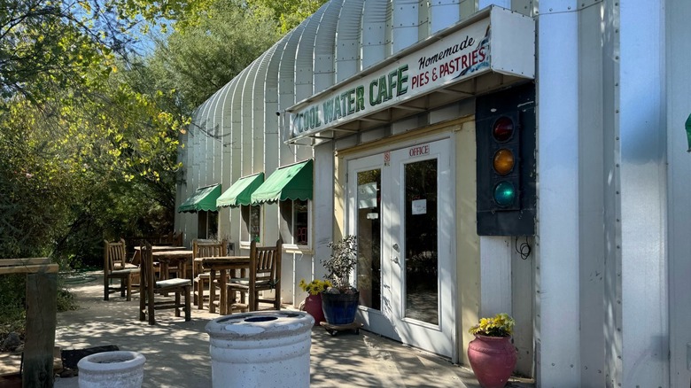 Exterior of Cool Water Cafe in Wikieup, Arizona, with tables and chairs