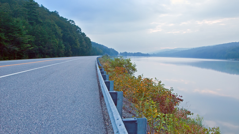 Wide views of Holman Lake and its forested shoreline from the road in Little Buffalo State Park.