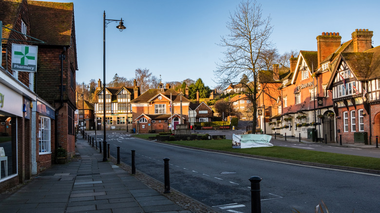 The war memorial and surrounding buildings in the town square of Haslemere, England